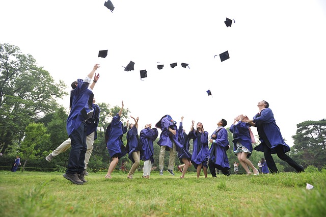 students throwing hats
